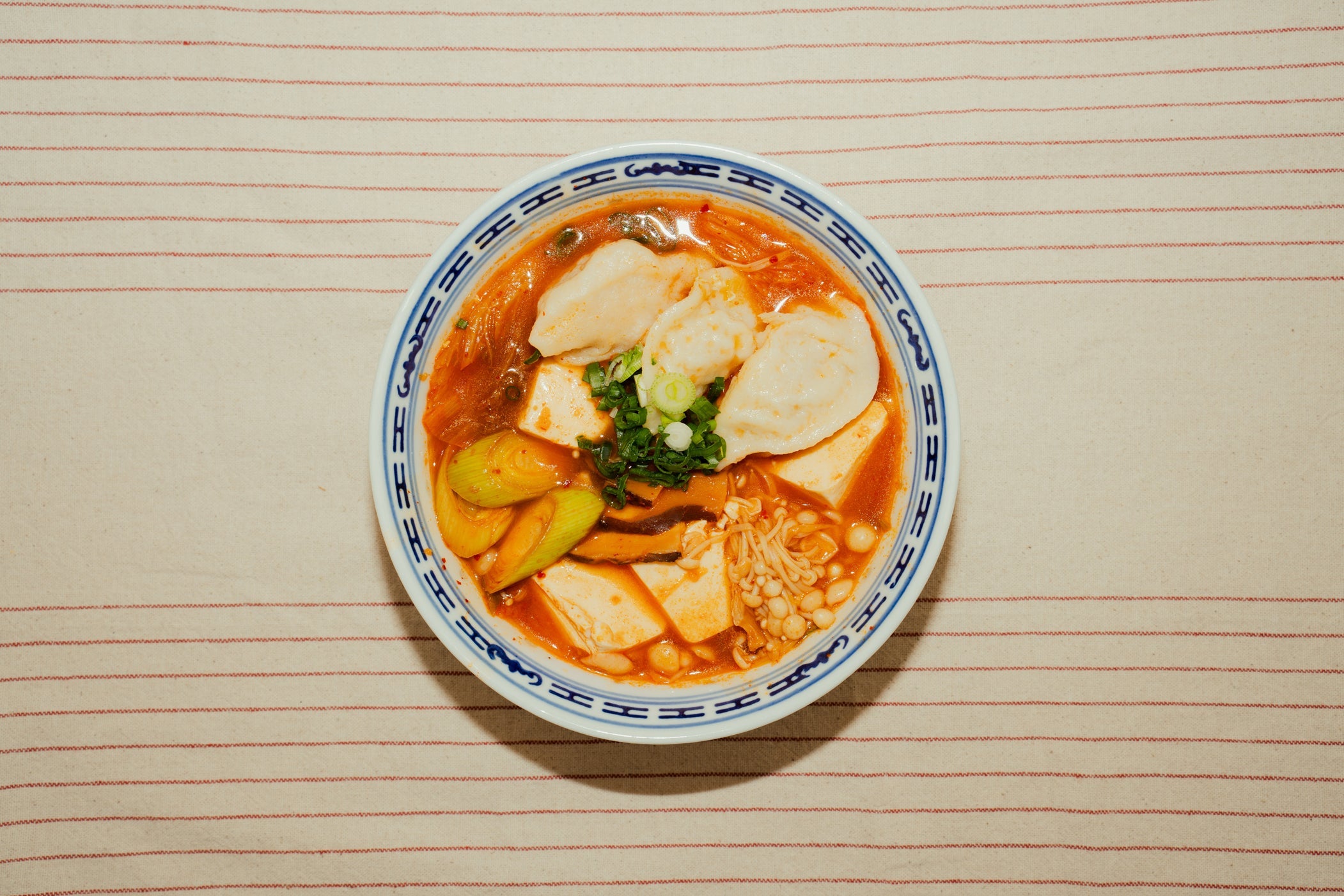 Kimchi Jjigae with Pork Soup Dumplings and Tofu